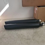 Black Slip-on Mufflers, 17-25 Harley Touring, Oem# 64901314, 64901315. Fixed Price $25.00.