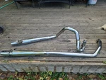2001 Harley Road King Exhaust & Muffler Bassani Power Curve Dual. Fixed Price $299.00.