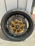 Aprilia RSV1000R Factory Front Wheel, Brake Rotors, Axle, Tire (complete). Fixed Price $249.00.